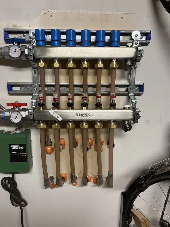 Plumber performing Water Heater Repair at a residential property in St. Paul Park